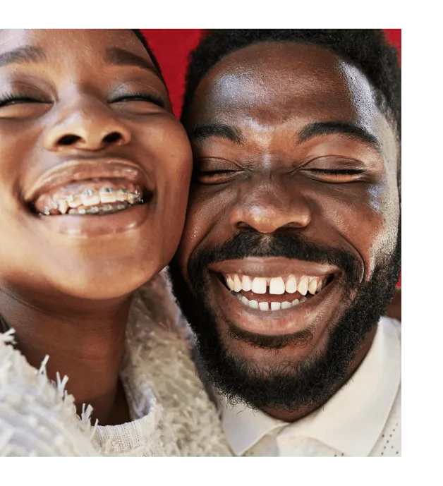 A young couple, happily laughing and smiling