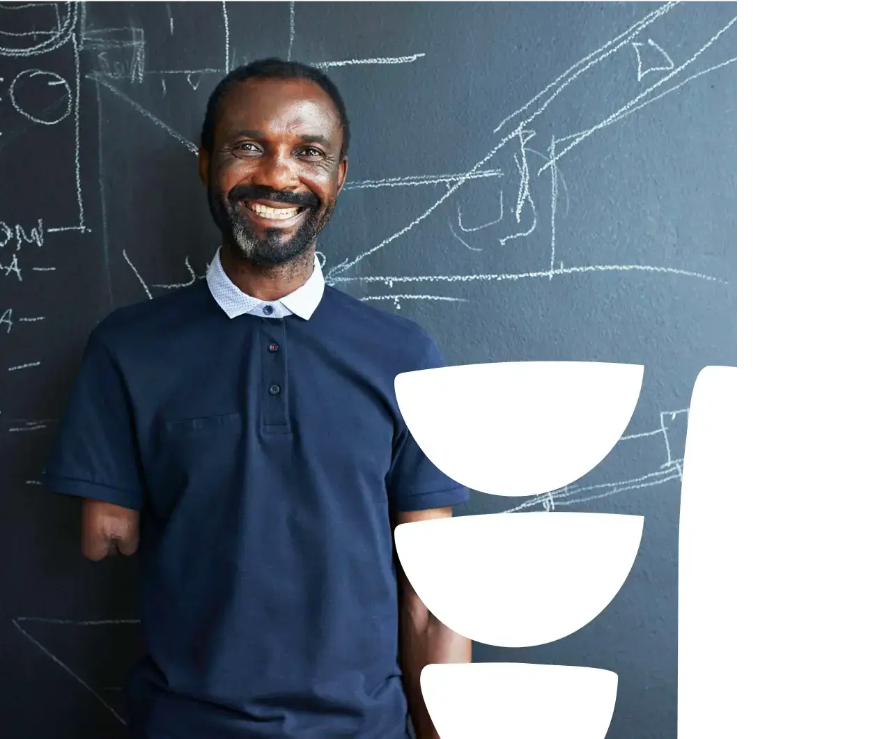 A smiling teacher who lost his right forearm